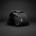 Filled black canvas saddle sandbag with timber handle and Modern Green tab