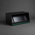 Comfort monitor hide — matt-black box with angled internal screen and Modern Green pinstripe