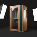 Self-contained acoustic podcast pod with oak and Deep Green exterior